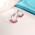 AD Flower Round Jhumka Red