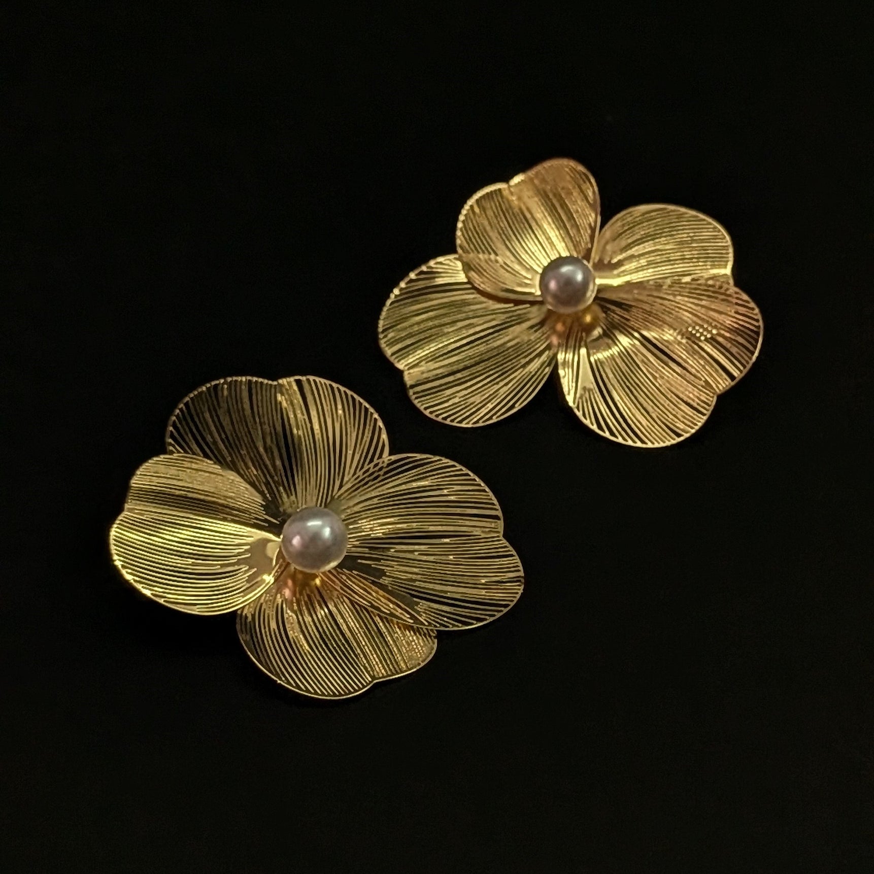 Gold flower statement earrings