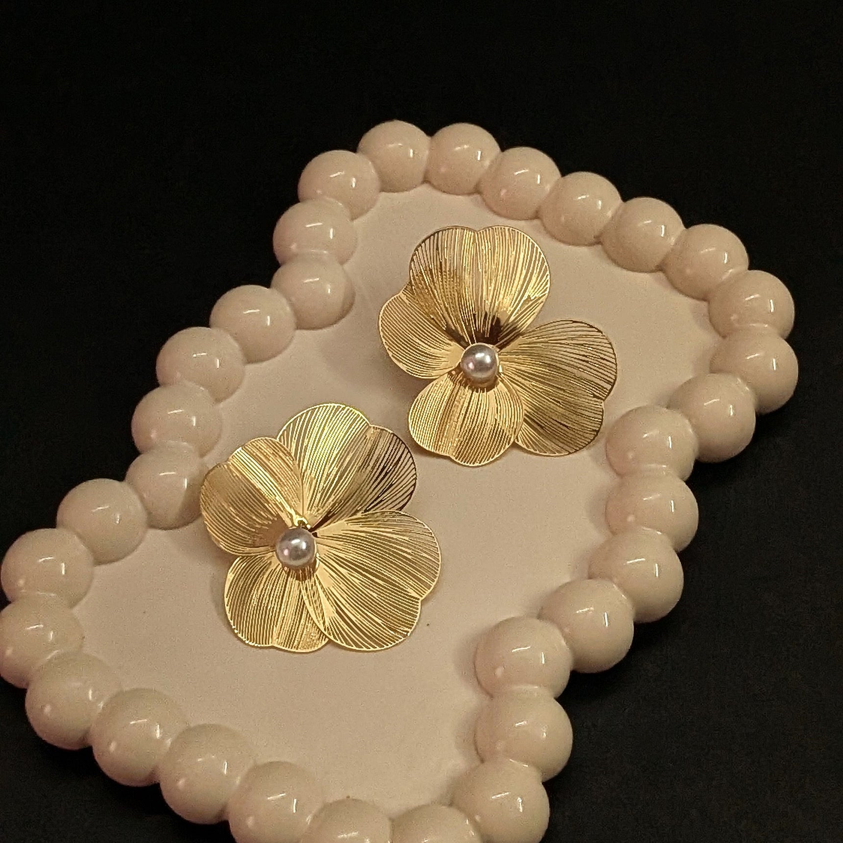 Gold flower statement earrings