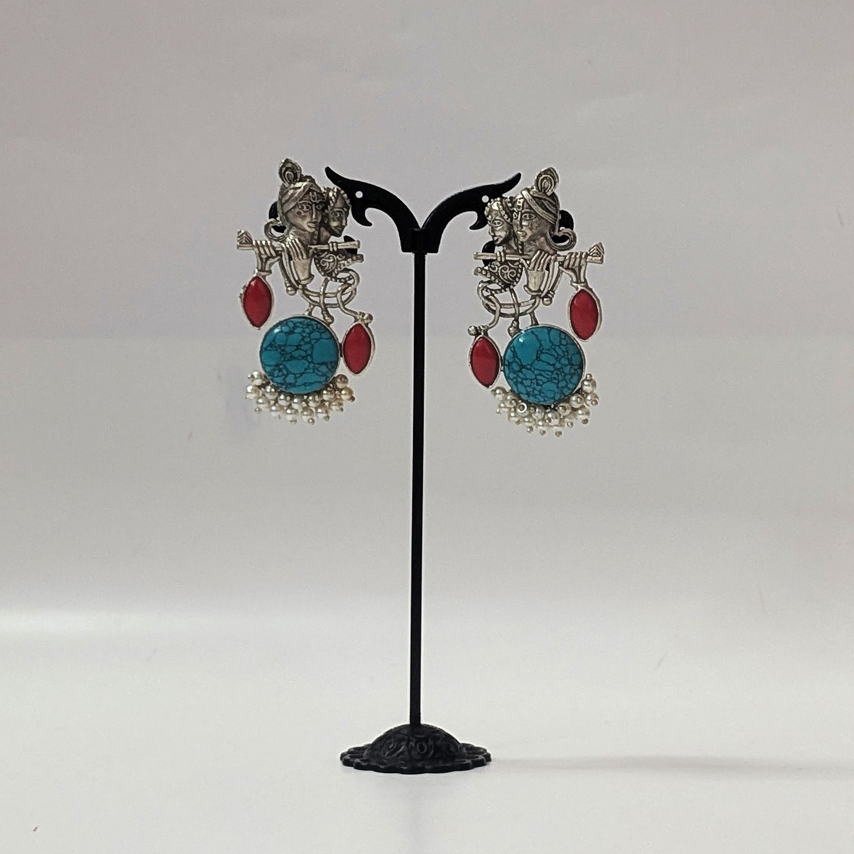 Radha Krishna Oxidized Silver Earrings with Turquoise Stone, Red Accents & Pearls