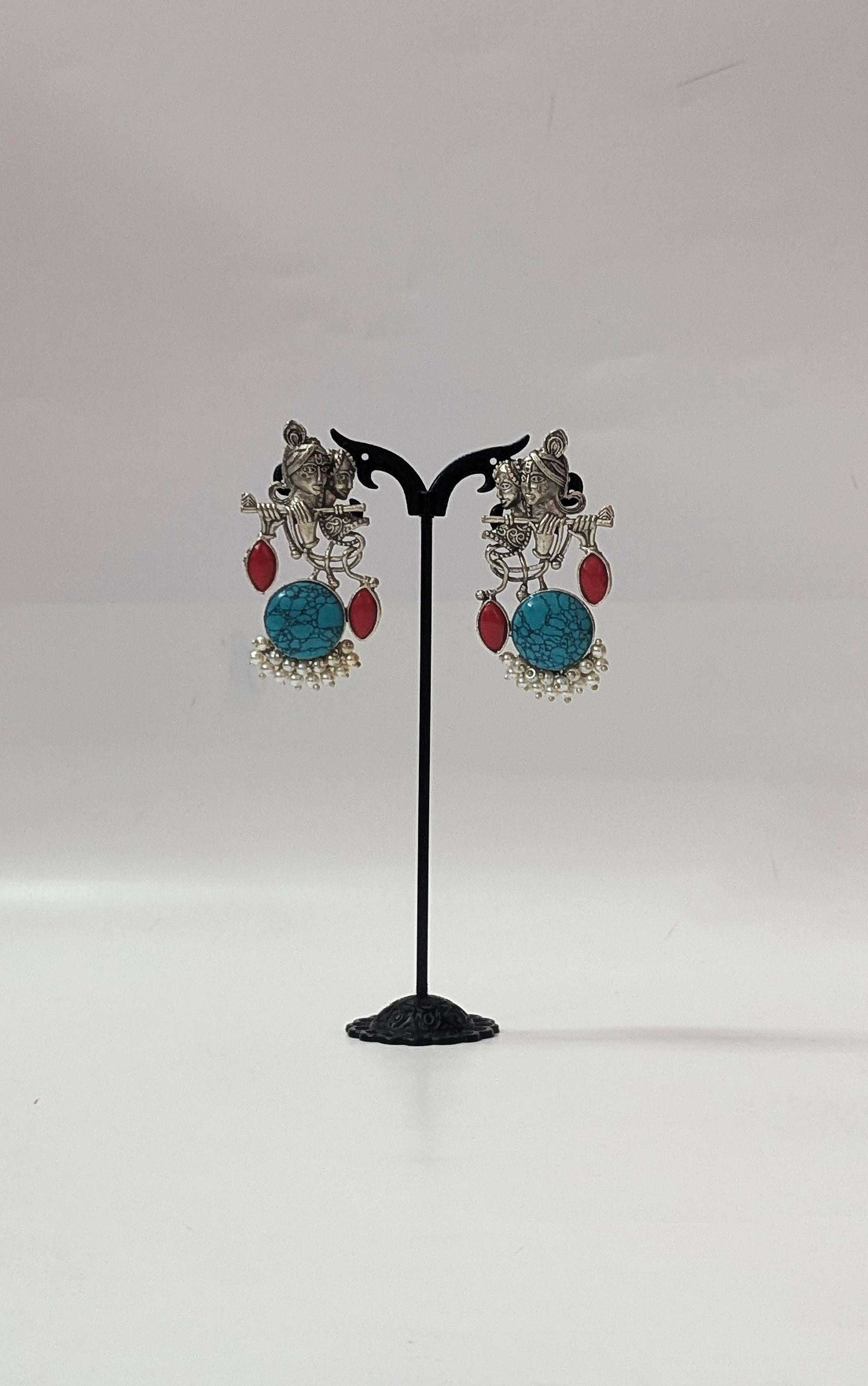 Radha Krishna Oxidized Silver Earrings with Turquoise Stone, Red Accents & Pearls